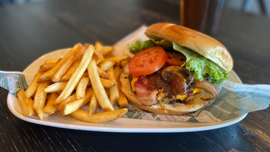 mushroom, bacon cheeseburger with lettuce and tomato and fries